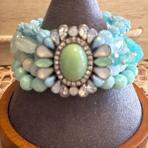 Breath of blues beaded bracelet with cabachon pale mint green beaded center